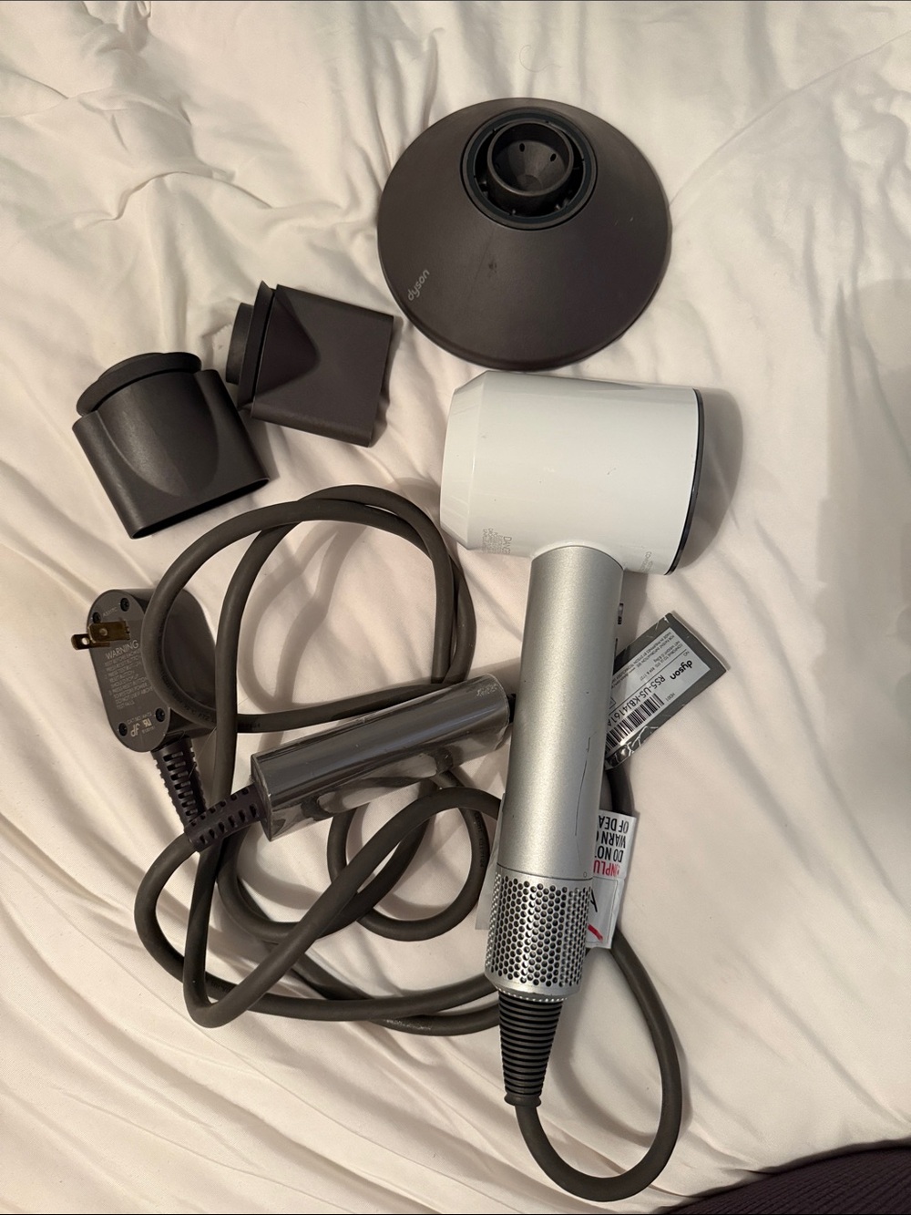 Dyson Supersonic Hair Dryer in White and Silver with Dark Gray Attachments